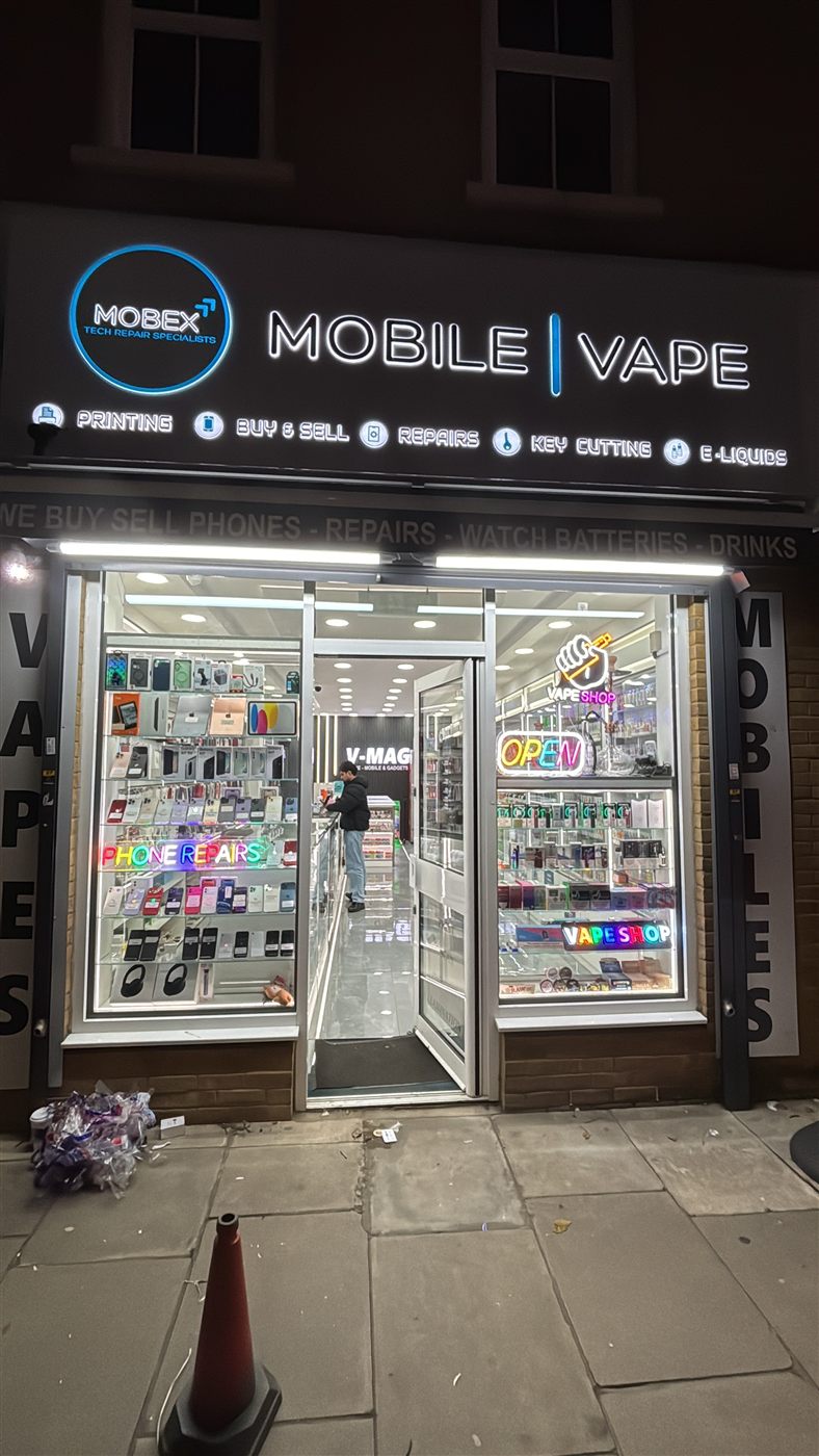 Mobex phone repair shop lit up at night on North Finchley High Road
